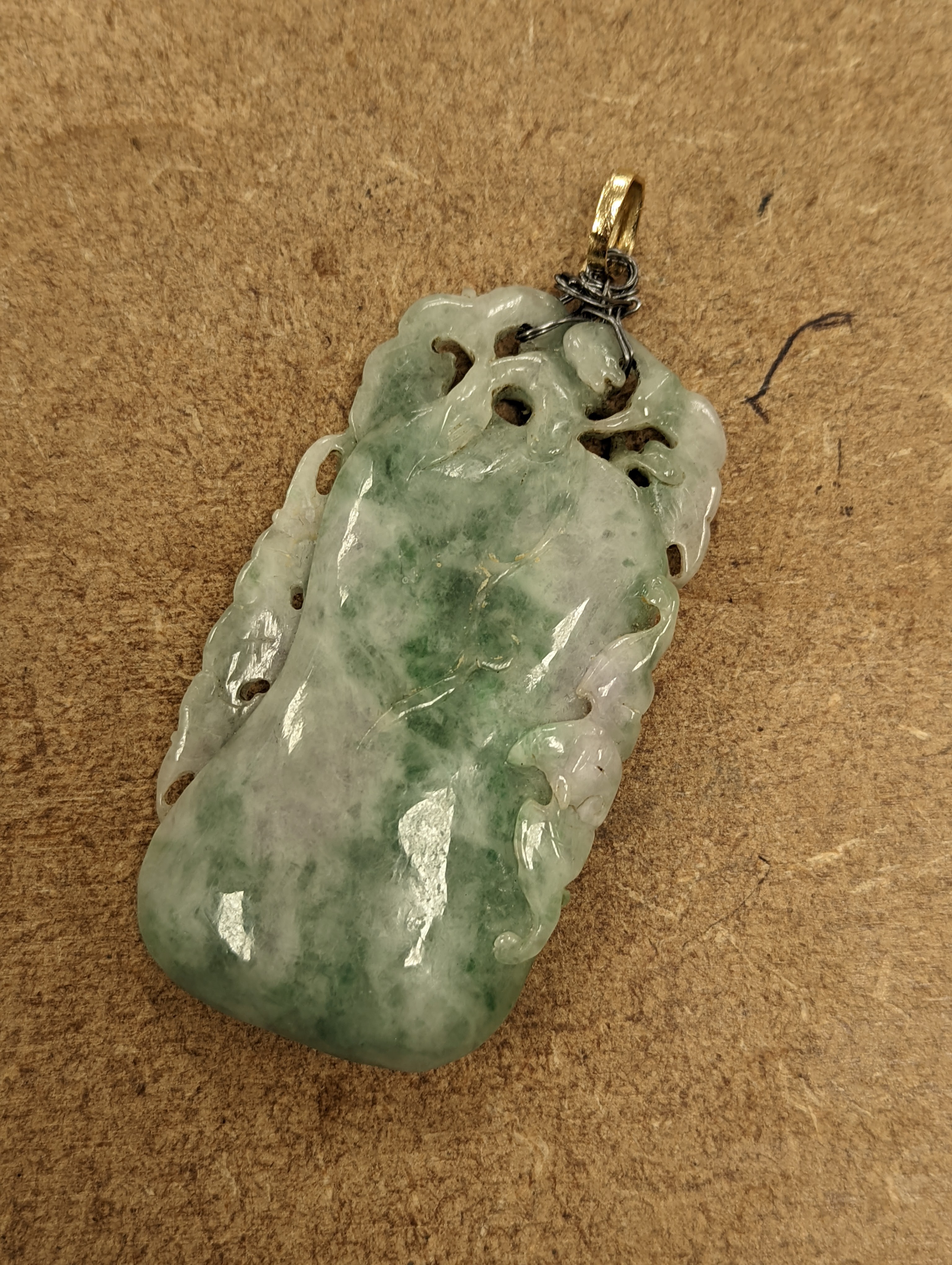 A Chinese mottled jadeite plaque 8cm